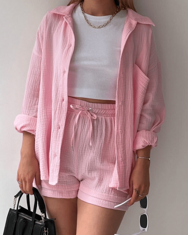 Women's casual two-piece summer outfit with oversized button-up shirt and wide-leg pants in linen