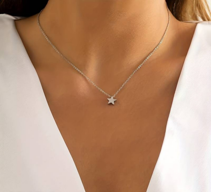 Stylish women's star necklace, a delicate celestial fashion accessory available in adjustable gold & silver.