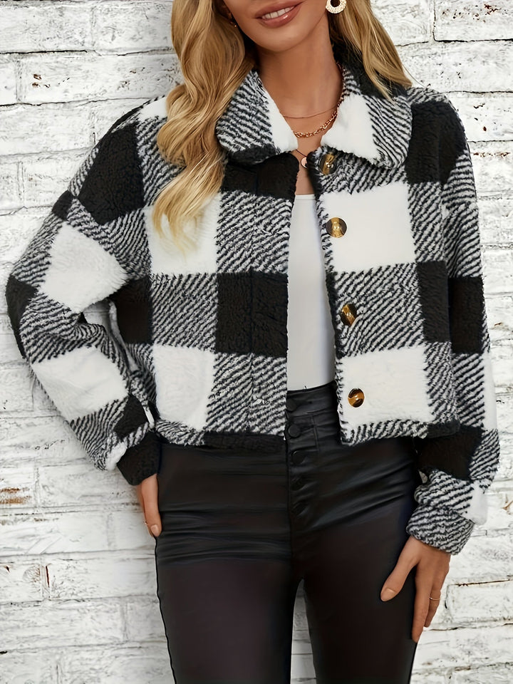 Warm plaid button-up coat for women. Cozy long sleeve winter outerwear with a stylish checked design.