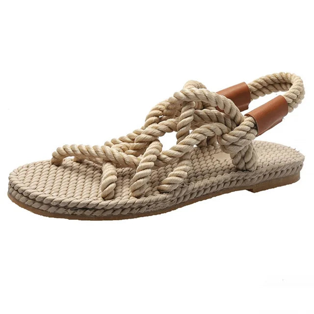 Women's chic beige braided gladiator sandals, comfortable flat summer footwear for beach, vacation & casual adventures.
