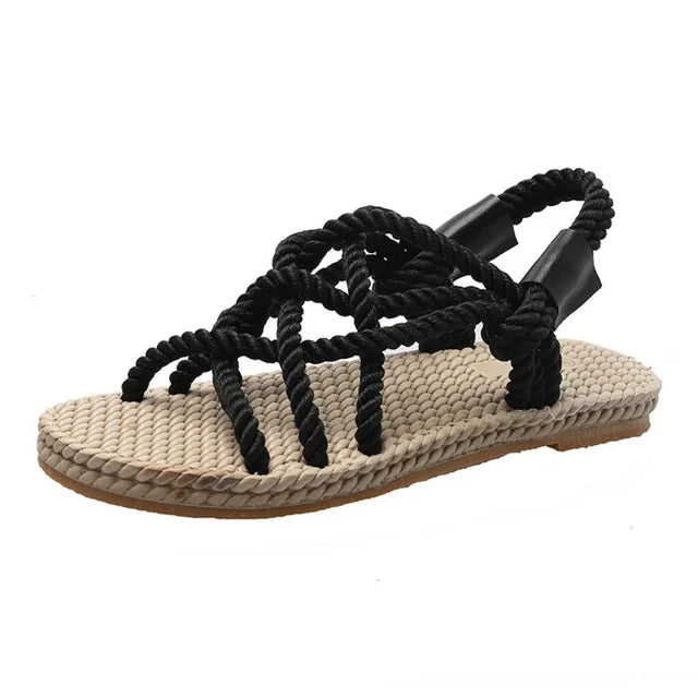 Comfortable women's braided rope gladiator sandals, perfect flat slip-on summer footwear for beach, vacation & casual wear.