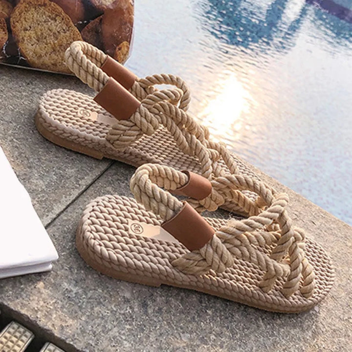 Adjustable women's braided gladiator sandals in beige, a comfortable flat slip-on design for summer adventures & beach.