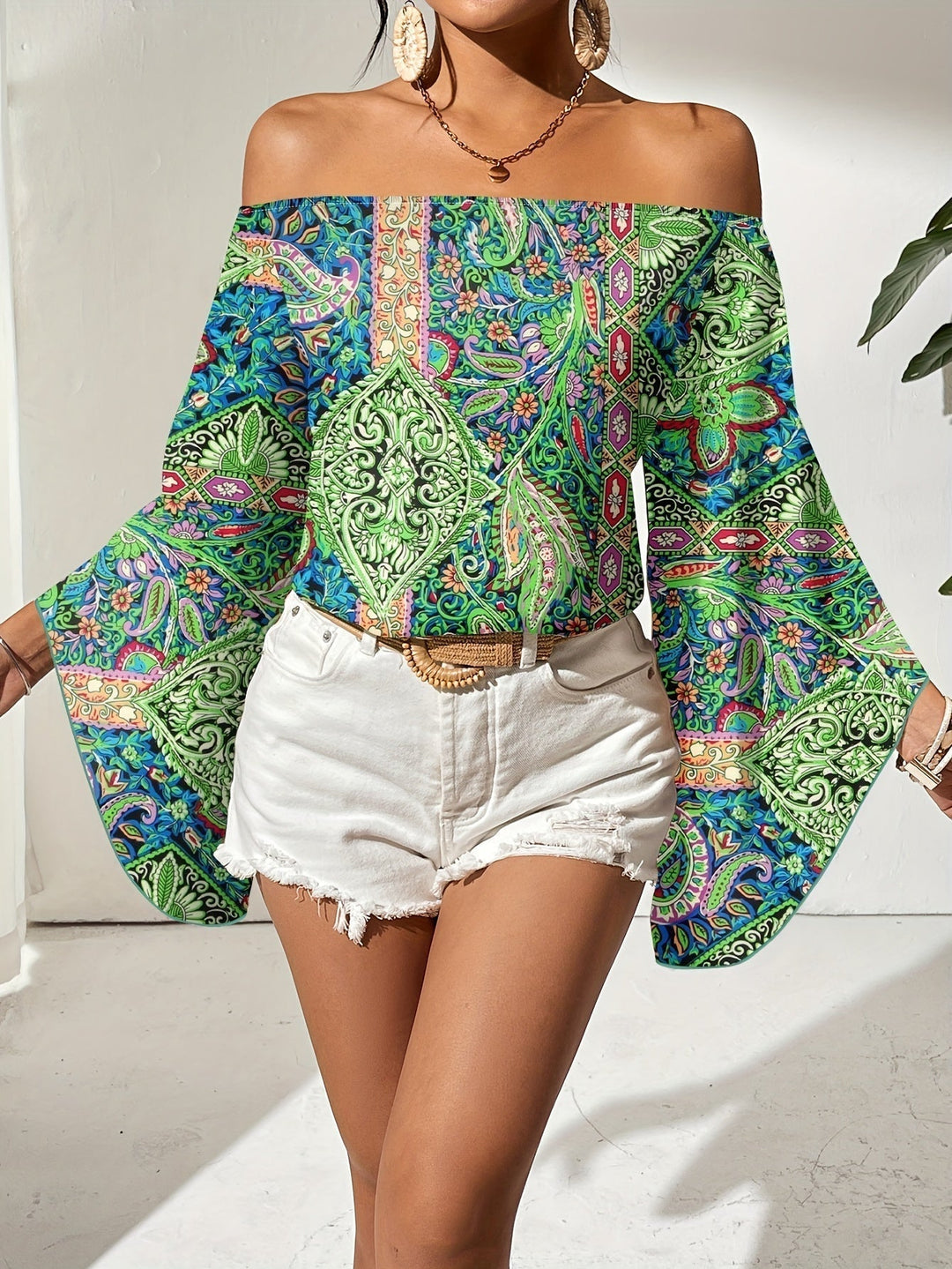 Summer style women's off-shoulder blouse, a vibrant fashion top with an eye-catching geometric print.
