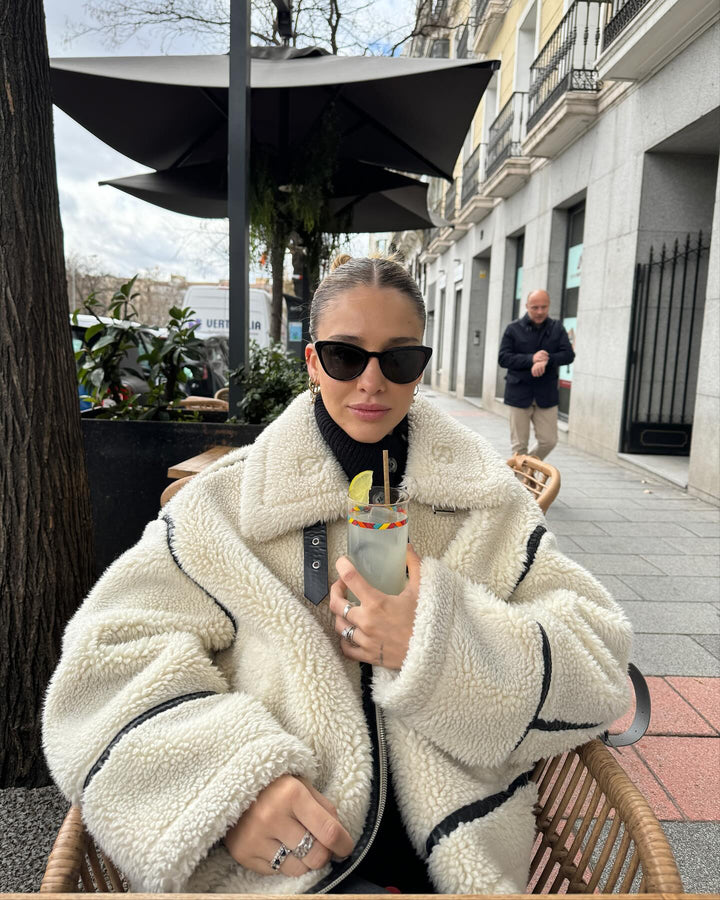 Trendy women's chic oversized aviator jacket in cream, a stylish and cozy statement piece for fall.