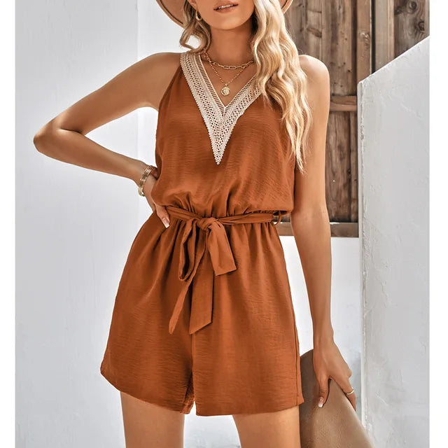Comfortable women's patterned V-neck summer playsuit with shorts. A stylish one-piece romper for warm weather fashion.