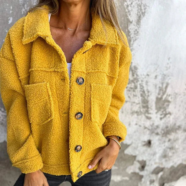 Women's chic short teddy coat with lapel collar. Cozy fall/winter outerwear, perfect for casual style.