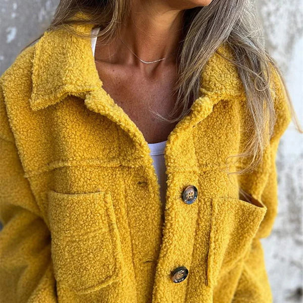 Plush women's short teddy jacket with stylish lapel. Warm, cozy outerwear for fall & winter fashion.