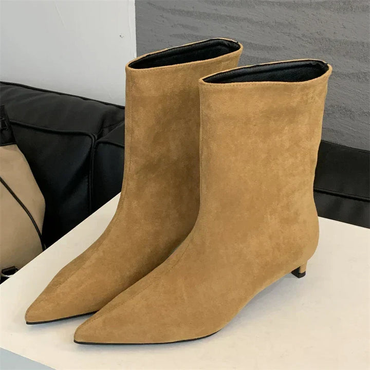 Women's chic Sorena suede ankle boots for winter. Stylish pointed toe, low heel design for elegant comfort.