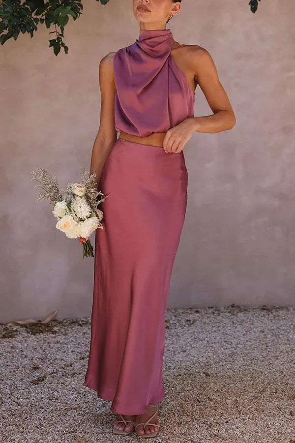 Elegant sleeveless top & matching skirt create a stylish women's two-piece fashion outfit.