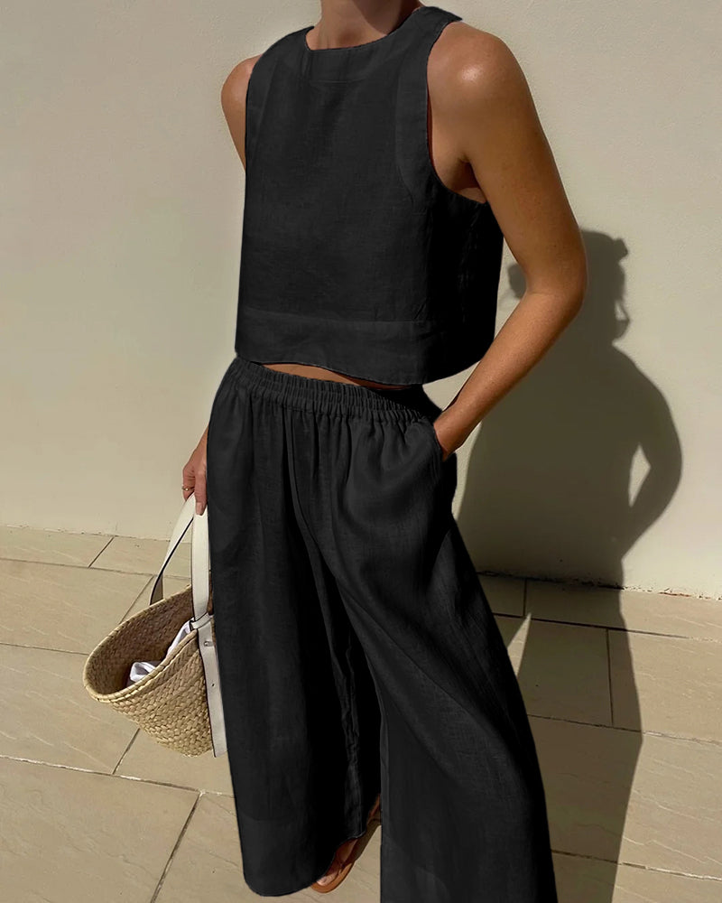 Comfortable women's cotton linen crop top & wide-leg pants set. Versatile for lounge wear or elegant summer fashion.