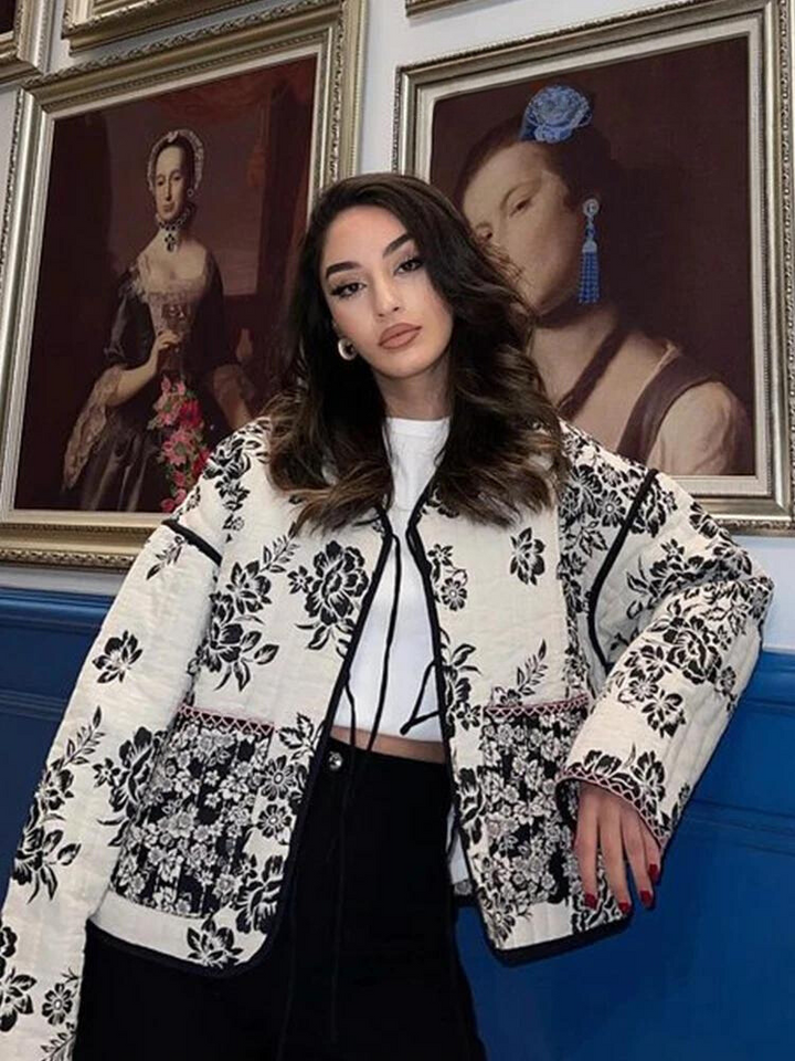 Casual chic women's vintage jacket with vibrant floral patchwork. Elegant layering outerwear for stylish women.