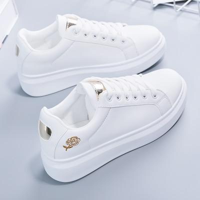 Bestselling Norell women's sneakers, white with chic metallic details, for ultimate comfort & style.