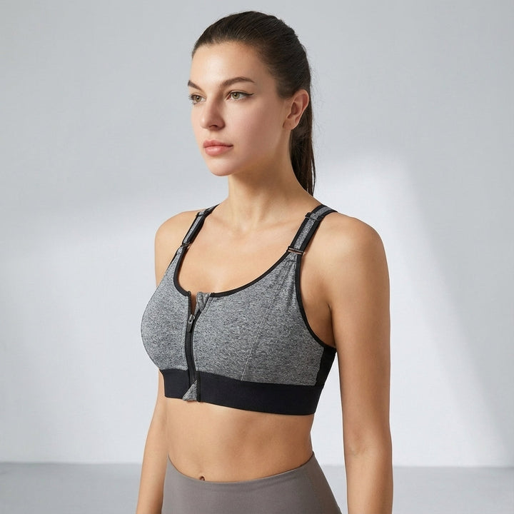 Athletic women's bra with adjustable straps and front zipper, great for various exercises