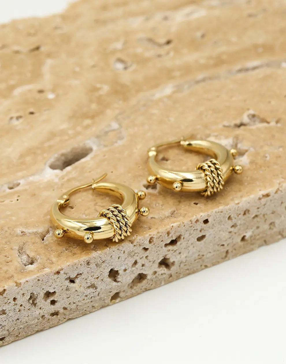 Women's chunky Bali hoop earrings, available in radiant gold and sleek silver, perfect statement jewelry.