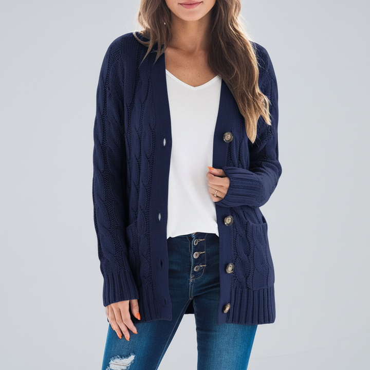 Full shot of a woman wearing a comfortable classic v-neck knit cardigan with convenient pockets