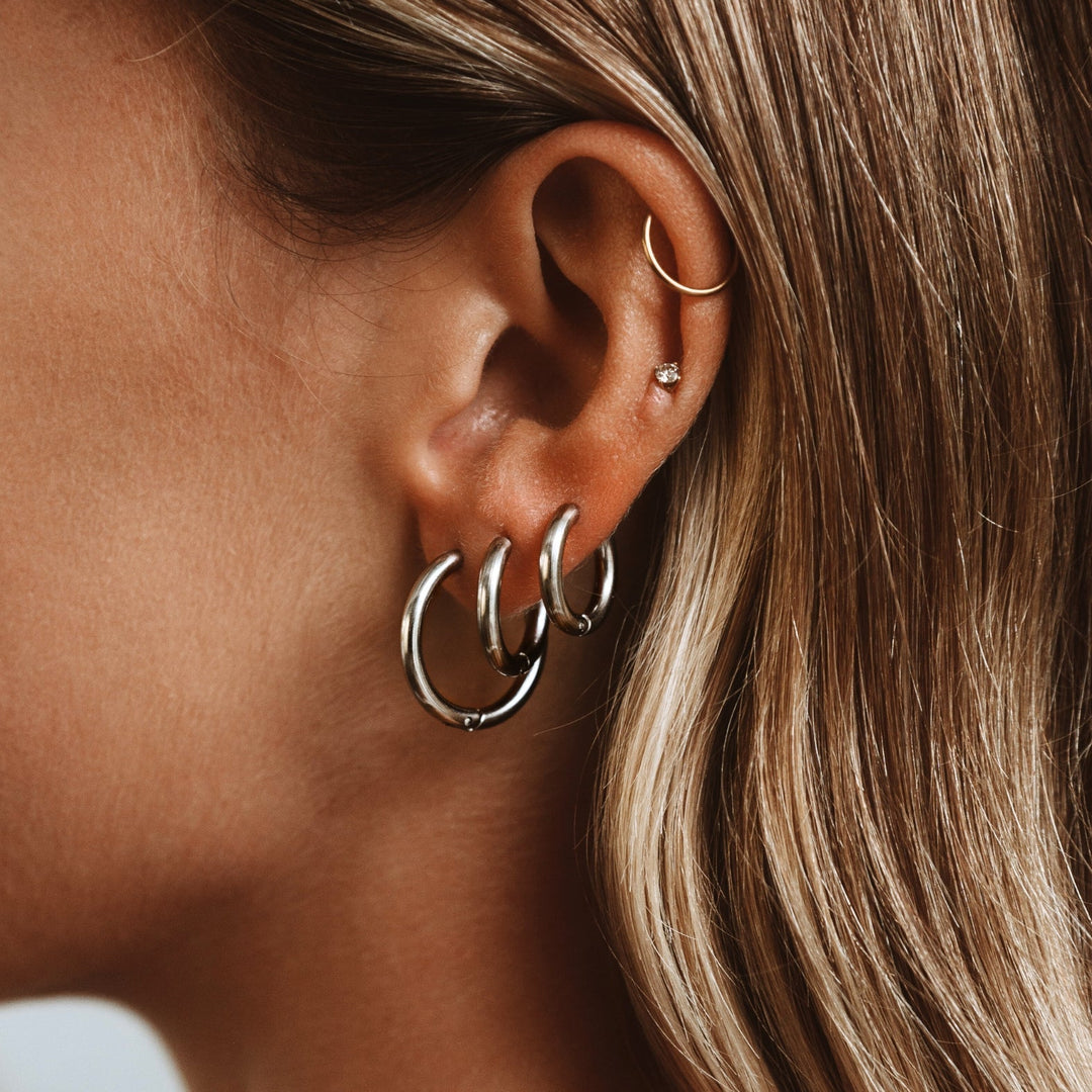 Refined silver hoop earrings for women, timeless design, ideal jewelry accessory.