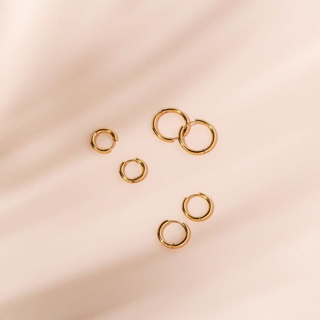 Versatile silver classic hoop earrings for women, simple and elegant jewelry accessory.