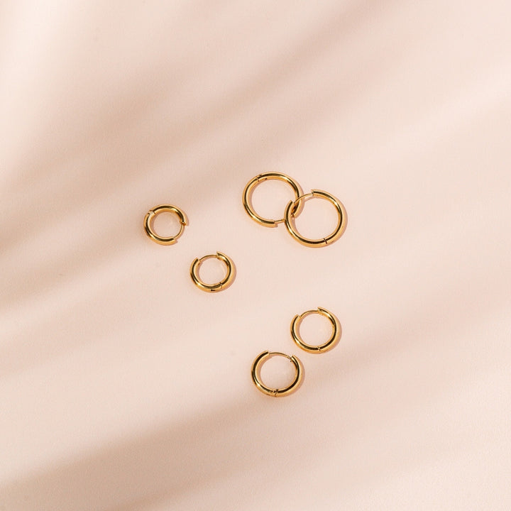 Versatile silver classic hoop earrings for women, simple and elegant jewelry accessory.