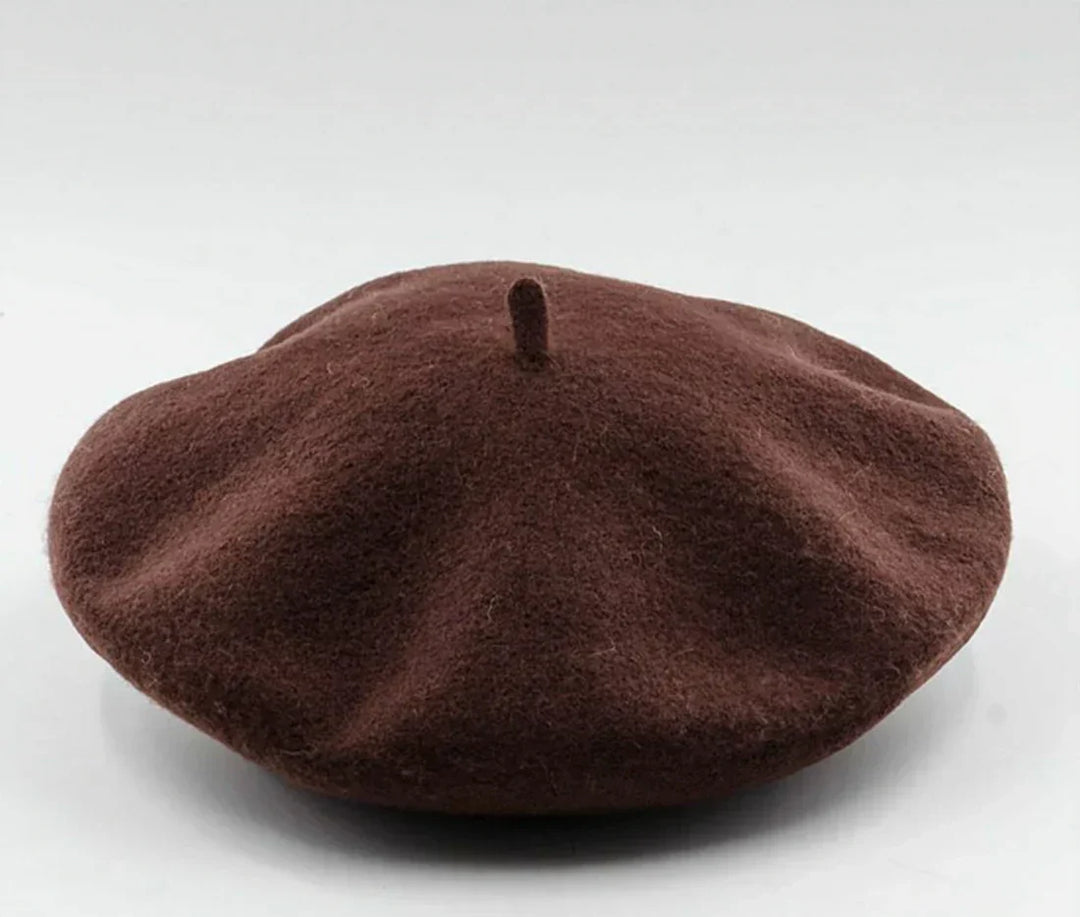 Women's wool beret hat in maroon, a sophisticated and warm headwear option for winter.