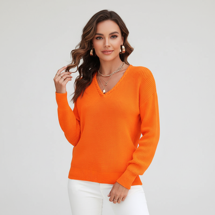 Detail of the knit pattern on a women's classic V-neck sweater, emphasizing its quality.