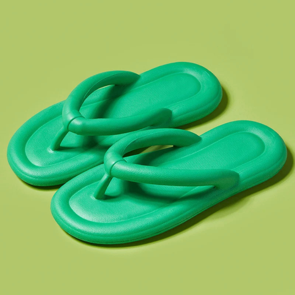 Women's cloud-soft comfort flip-flops, essential vacation footwear with ergonomic and soft soles.
