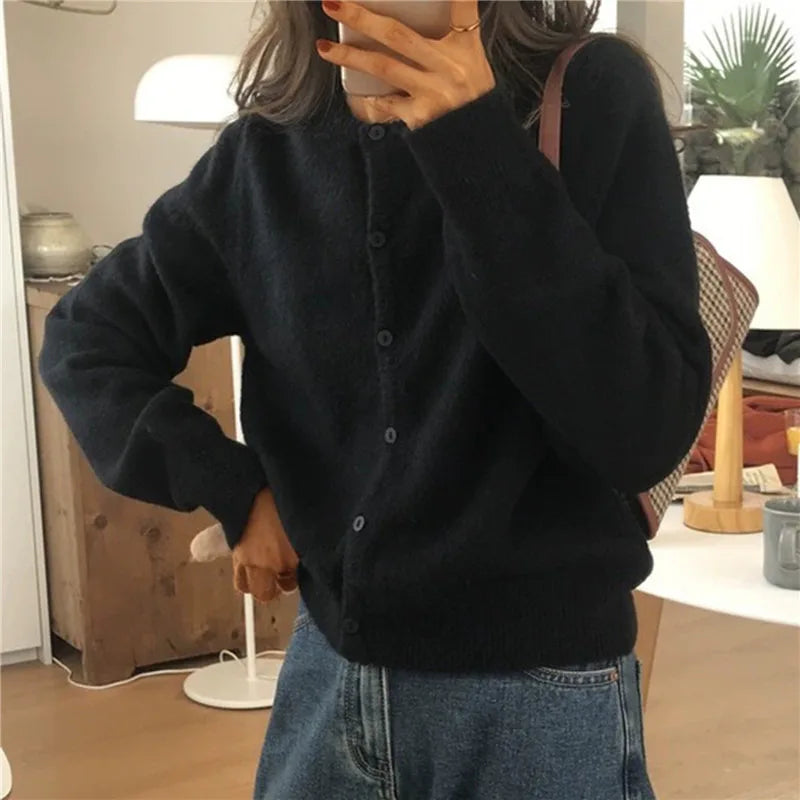 Women's comfortable button-front knitted cardigan, cozy winter fashion for everyday wear.