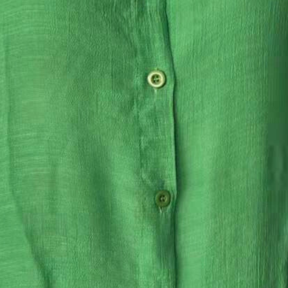 Close-up of soft fabric on women's comfort shirt dress, ideal for summer daily wear.