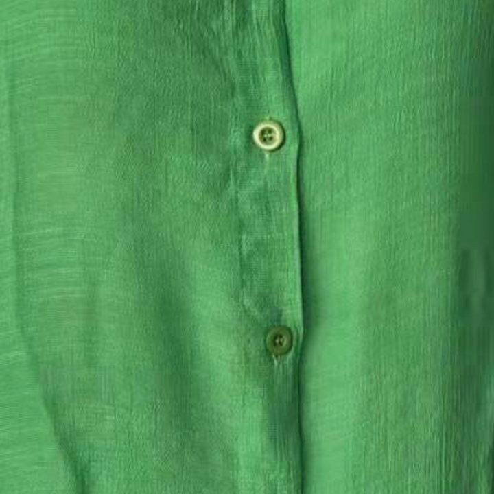 Close-up of soft fabric on women's comfort shirt dress, ideal for summer daily wear.