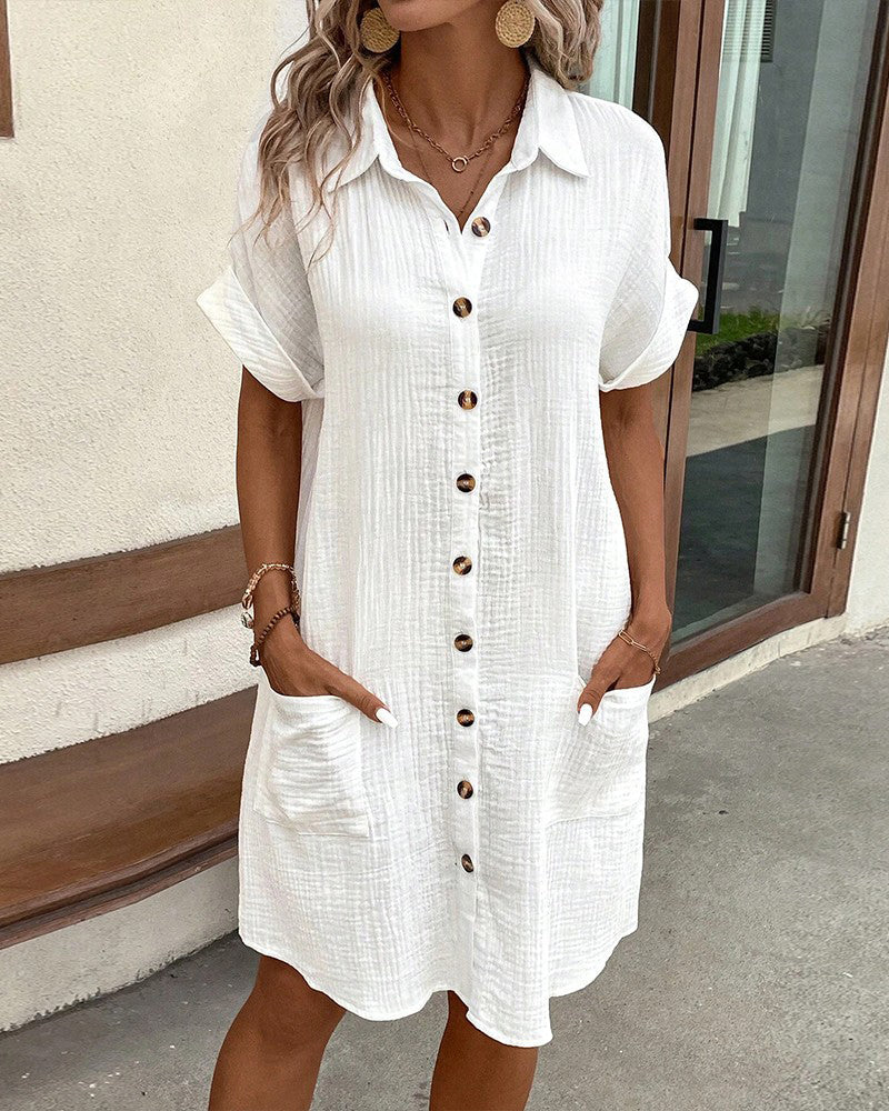 Women's comfortable summer dress with short sleeves & button closure. Ideal for warm weather and everyday wear.