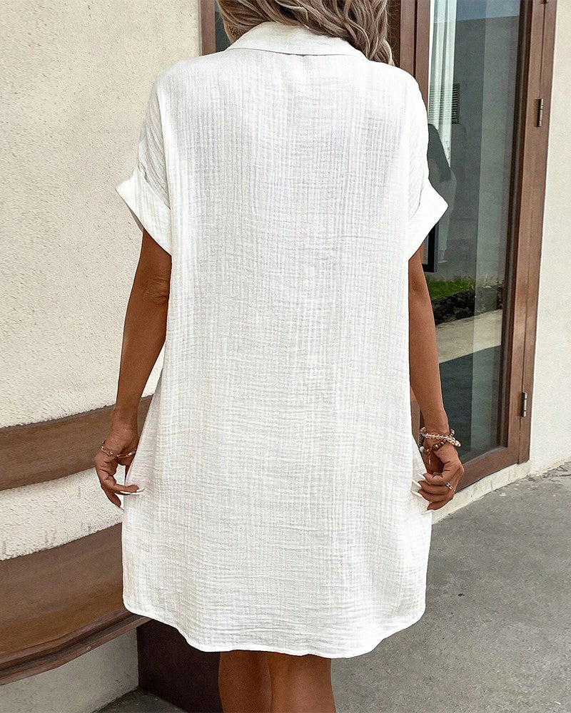 Stylish women's loose-fit summer dress with buttons. Versatile for casual outings or holiday wear.