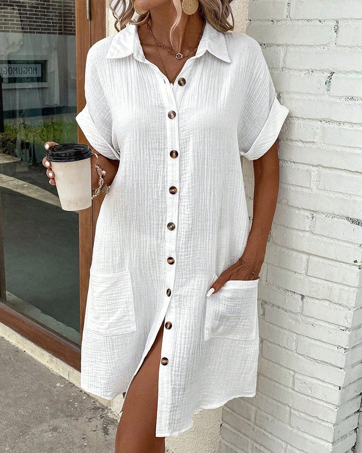 Practical women's button-front summer dress with short sleeves. Designed for maximum comfort on warm days.