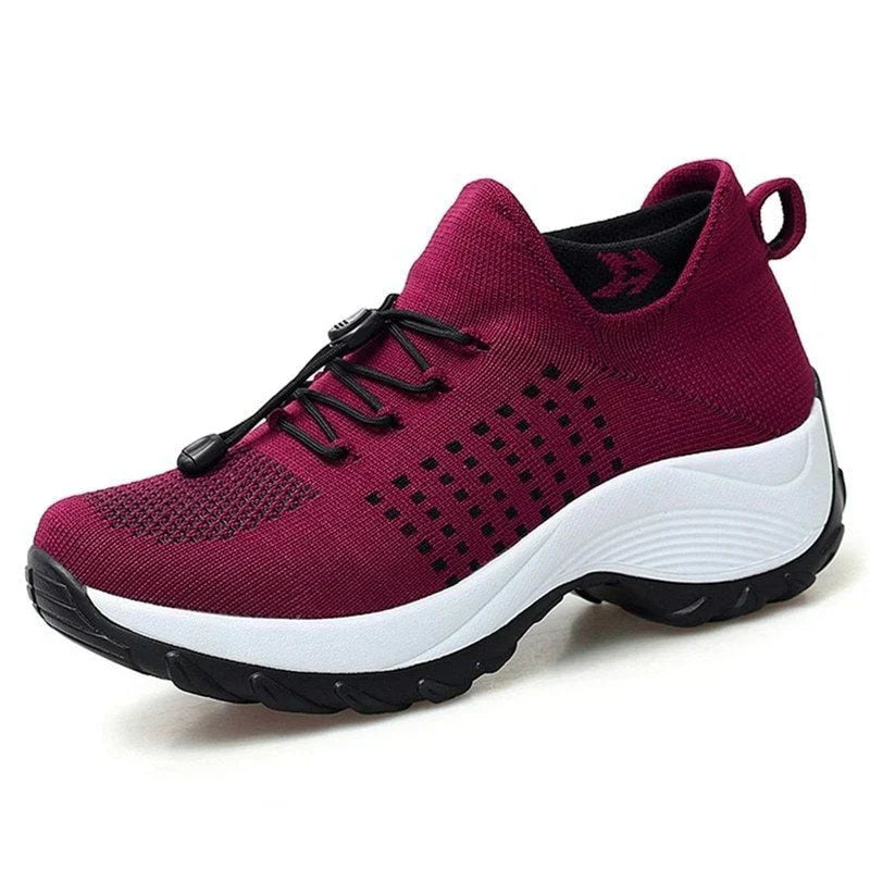 Pair of Women's ComfortEase orthopedic shoes in black, ideal for pain relief and support.