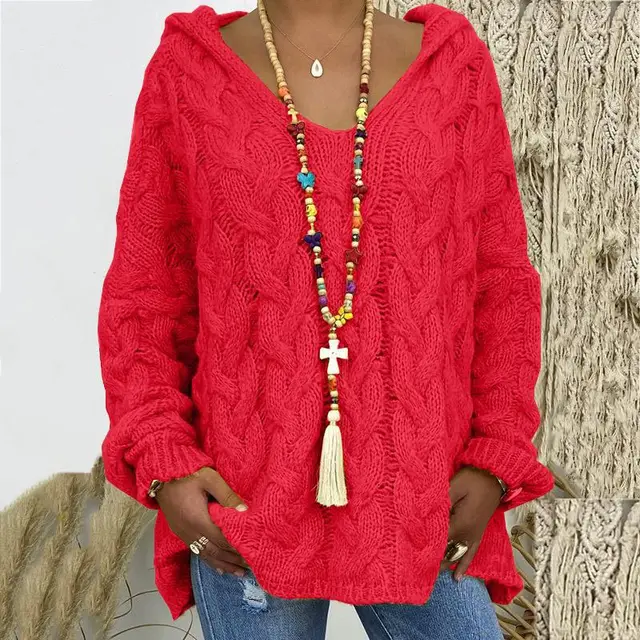 Charming women's cable knit pullover, embodying timeless style and luxurious winter comfort.
