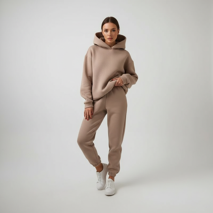 Women's winter fashion: a warm fleece hoodie and jogger set for casual outings.