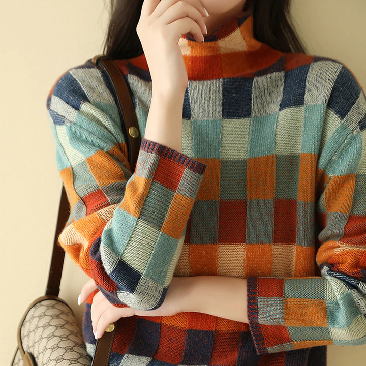 Warm women's turtleneck sweater. Cozy high-neck long sleeve pullover in melange knit for autumn fashion.