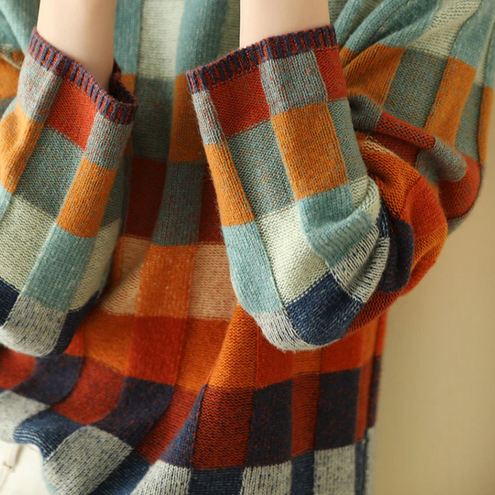 Soft women's cozy melange knit sweater with a high-neck, offering warmth and comfort for autumn/winter.