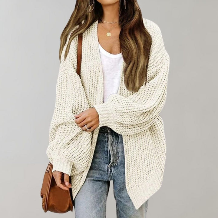 Chic women's knitted cardigan for cozy autumn and winter fashion, a versatile and comfortable layer.
