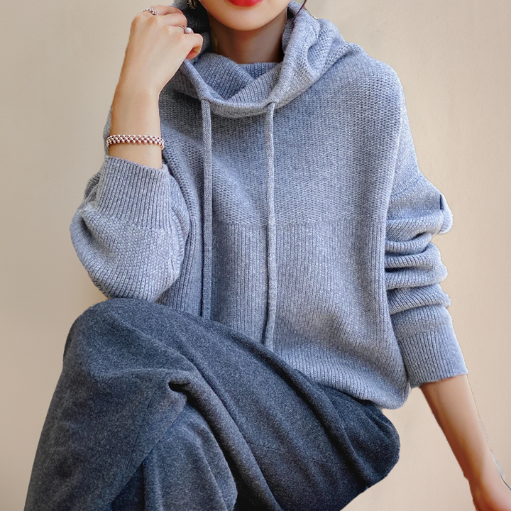 Warm women's high-collar merino wool sweater, cozy long-sleeve pullover for fall & winter apparel.