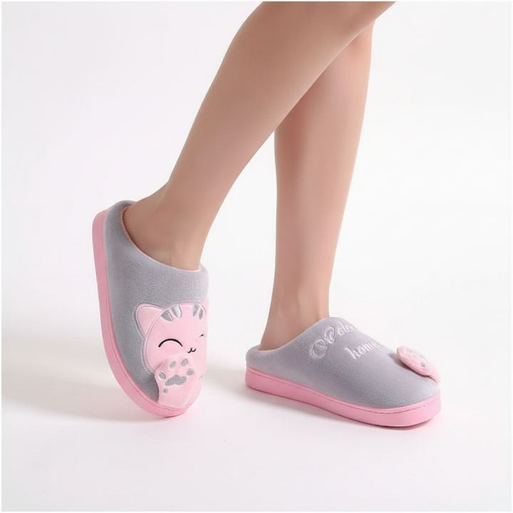 Women's cozy winter slippers, white, with cute animal design, offering ultimate comfort