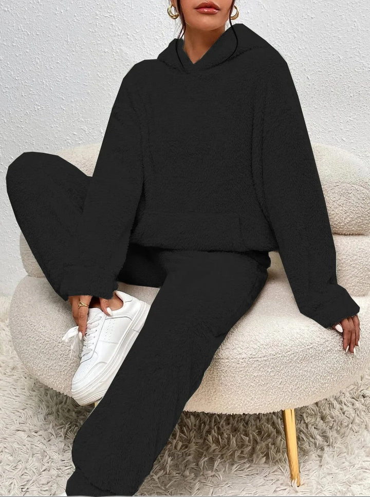 Cozy teddy loungewear set for women. Hooded design, soft fabric, perfect for winter comfort.