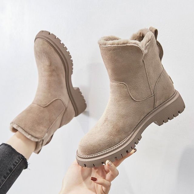 Women's CozyStride insulated winter boots; chic, warm, and comfortable with practical zip closure.