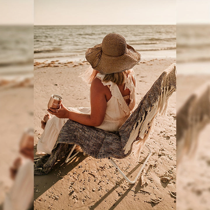 Woman enjoying the sun with a stylish crochet boho straw hat, ideal for summer travel.