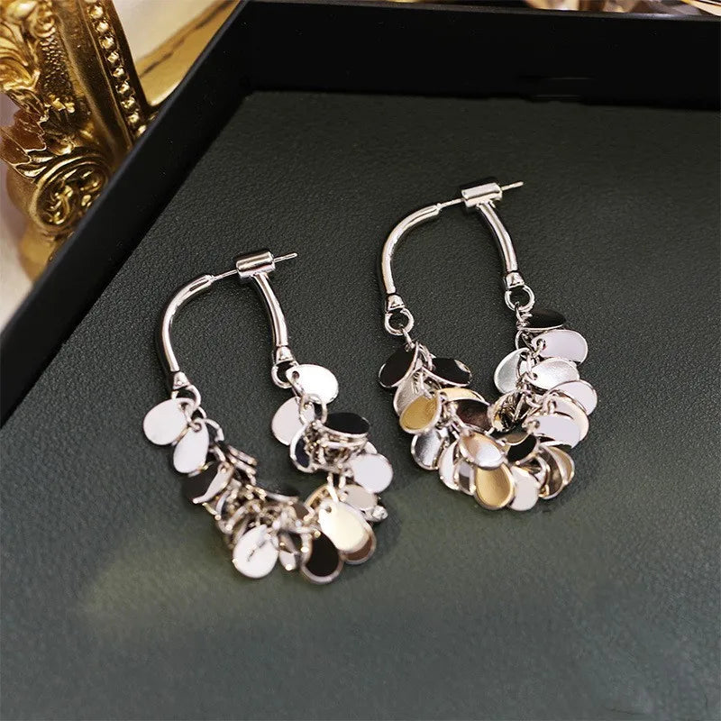Fashionable sequin tassel earrings, long drop style, perfect for adding a dazzling statement to any outfit.