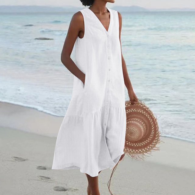 Woman wearing a light, breathable summer midi dress, showcasing its effortless casual elegance.