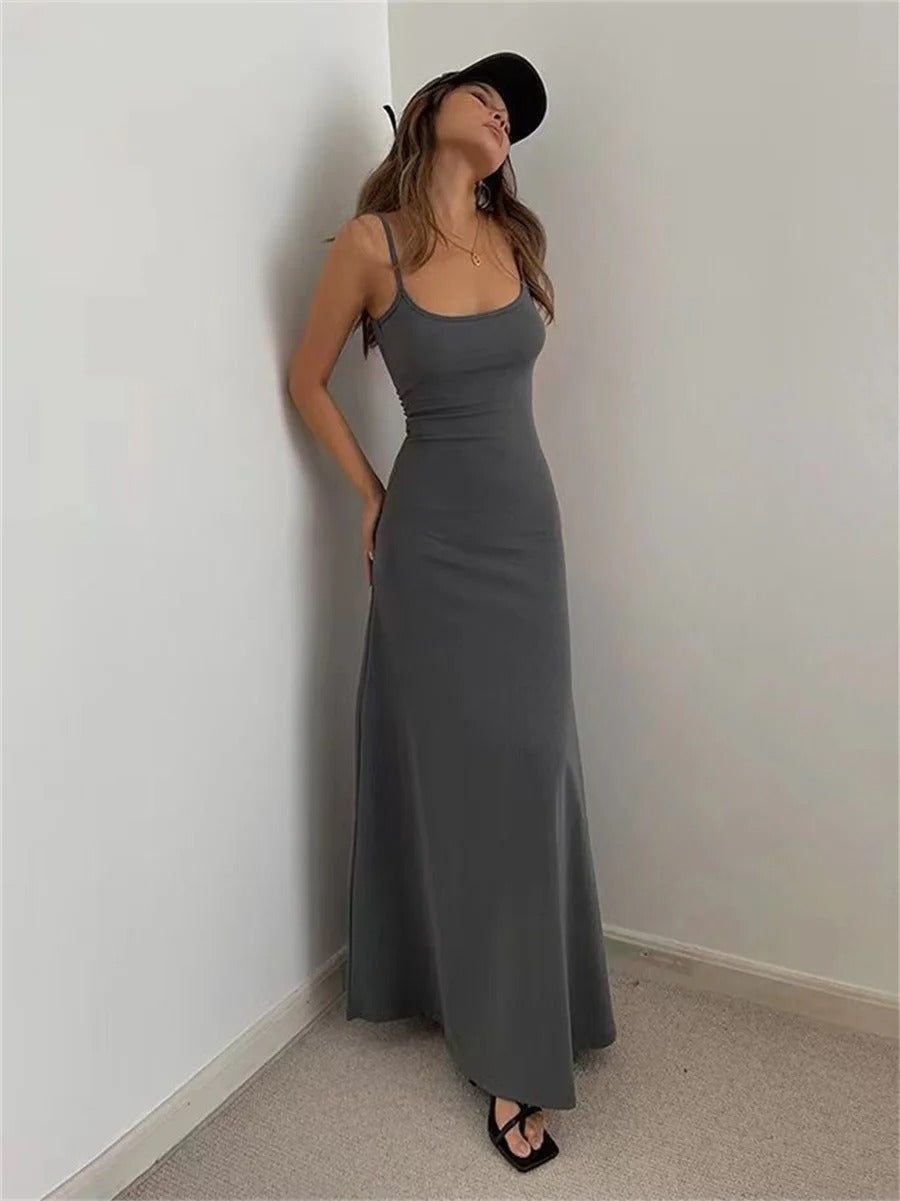 Stylish women's midi summer dress with delicate spaghetti straps & a comfortable, sleeveless design for warm weather.