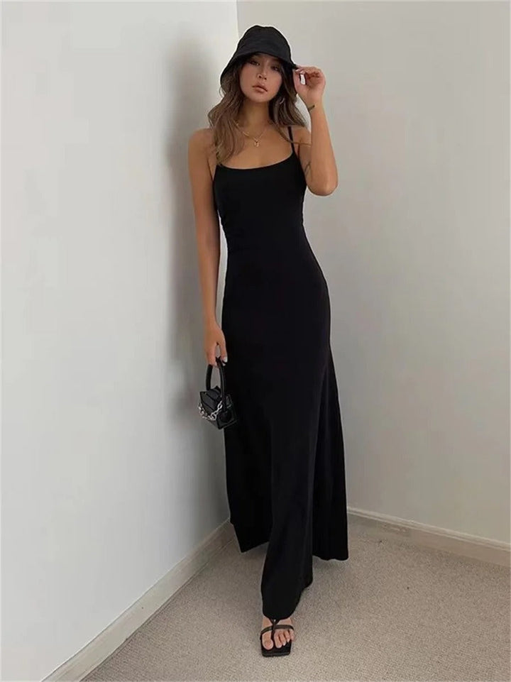 Effortless women's midi summer dress with thin spaghetti straps & a comfortable, breezy flowy silhouette.