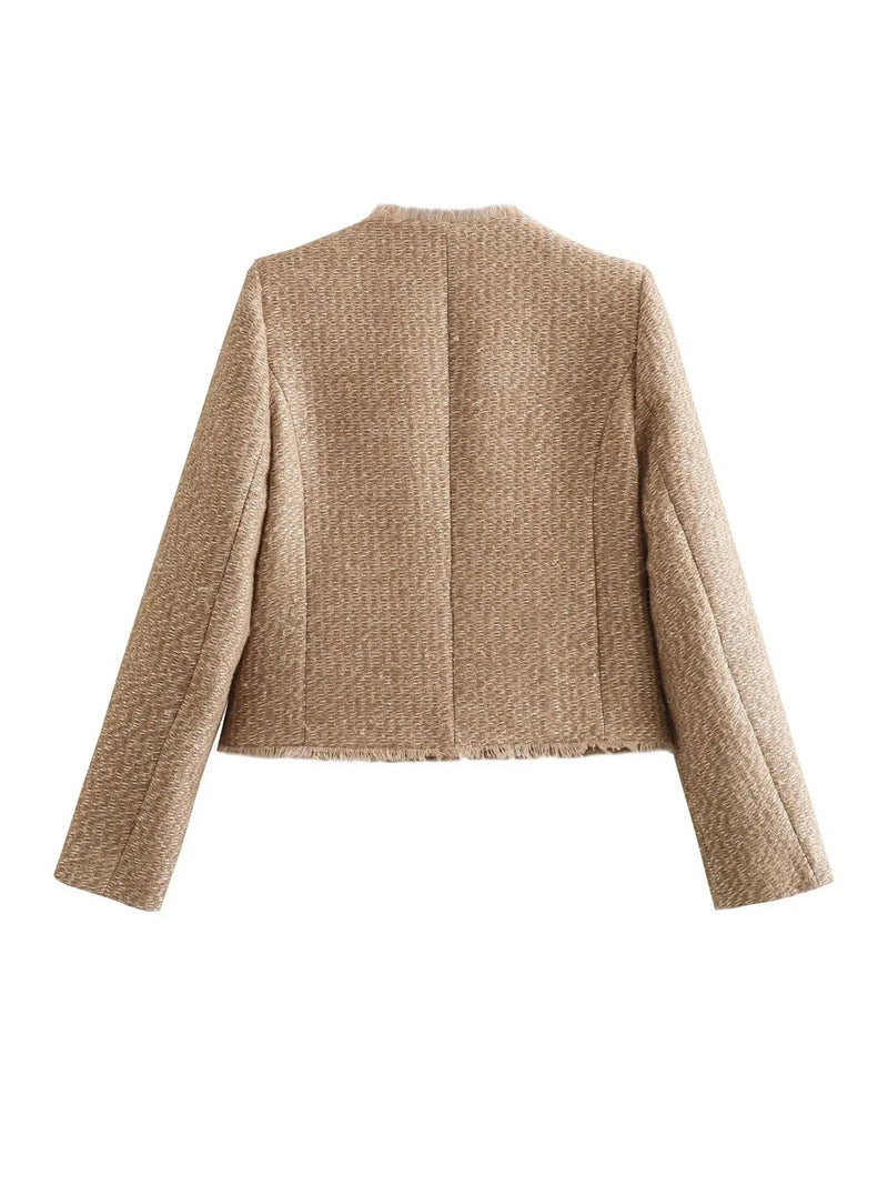 Luxurious beige tweed jacket for women, featuring exquisite gold buttons and a classic, elegant design.