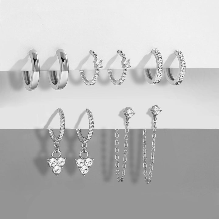 Detailed elegant dangle earrings with intricate design & shimmering crystals. Women's jewelry.