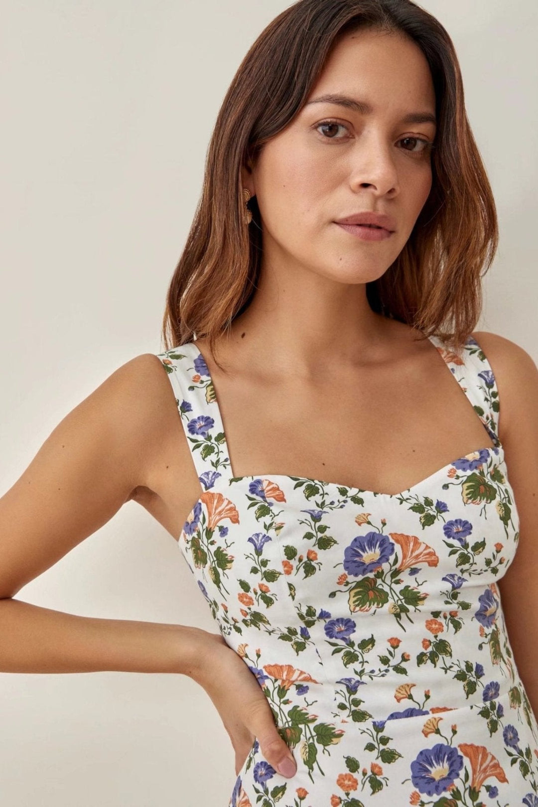 Stylish women's strappy floral midi dress with a comfortable flared silhouette, great for spring/summer.