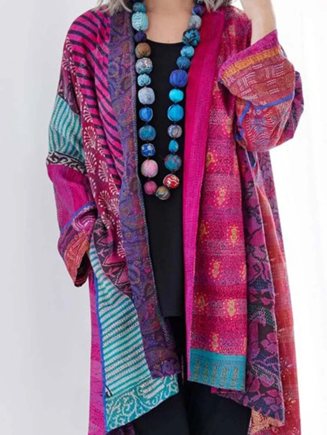 Women's elegant floral knit cardigan vest. Soft, colorful, perfect for versatile ladies fashion.